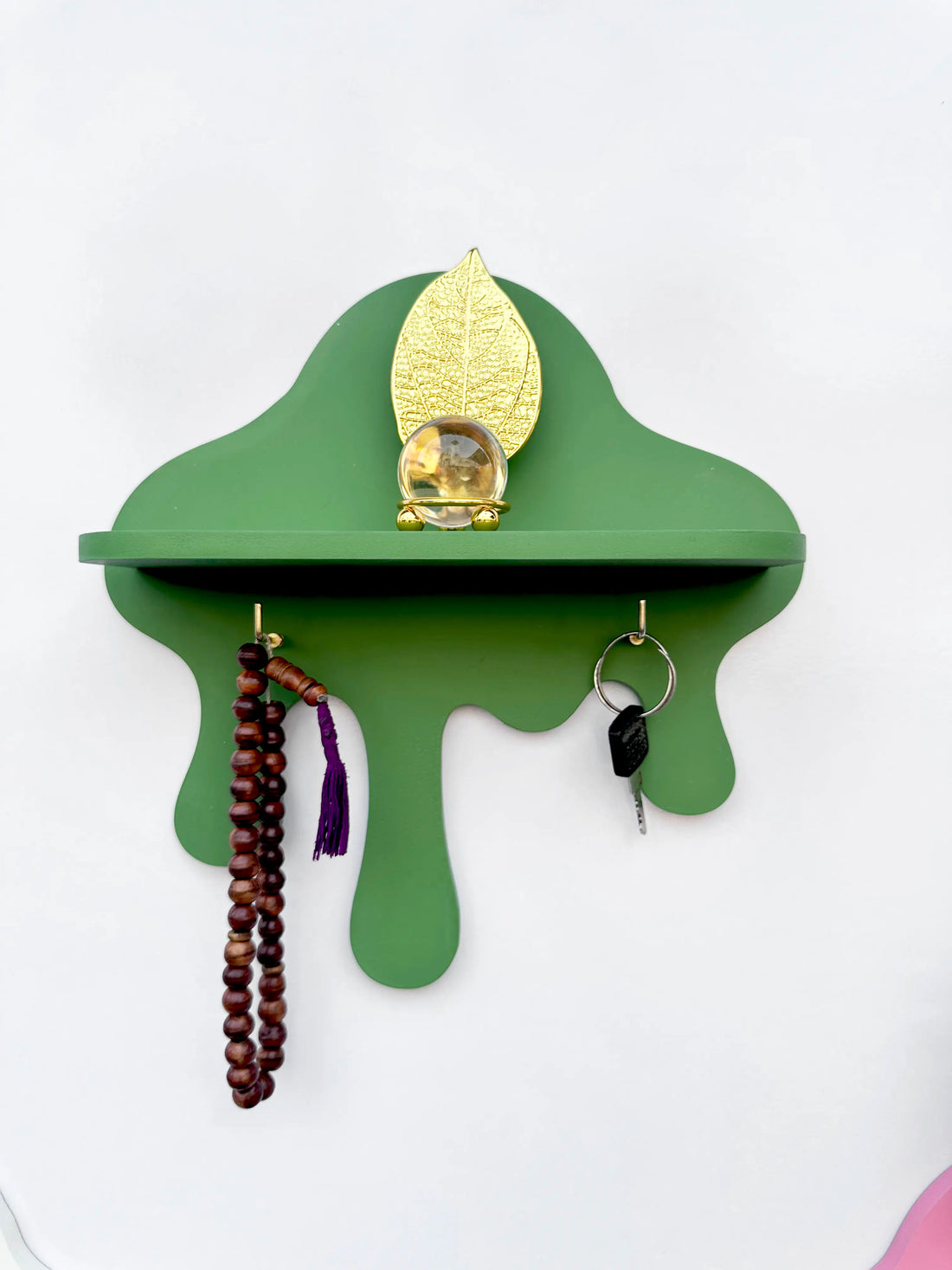 Green drip wall shelf with golden key hooks